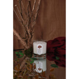  forbidden tree candle from prophet series collection with a tree and leaves.